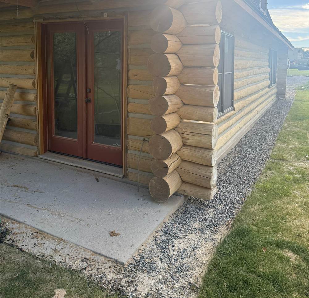 Refinished log corner and french doors on a restored Idaho log home
