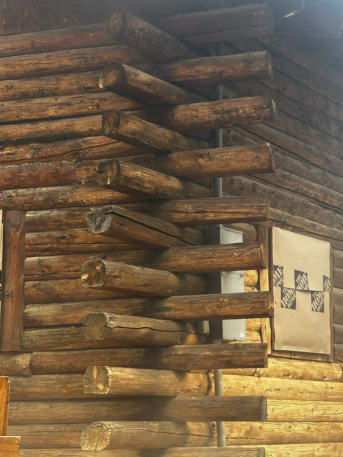 Log home corner notches media blasted back to bare wood, with windows covered, Wood River Valley, Idaho