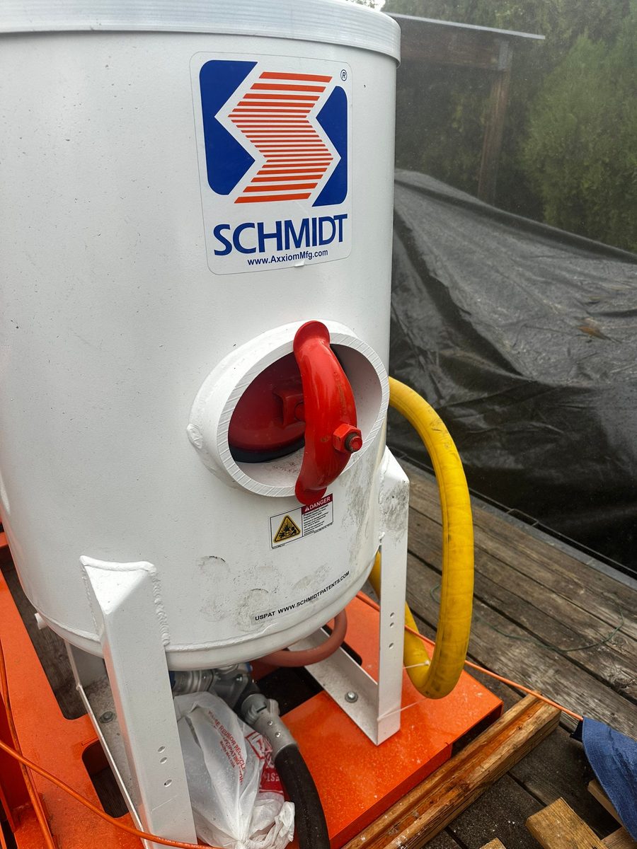 Schmidt blast pot on Chase Construction's trailer-mounted media blasting rig