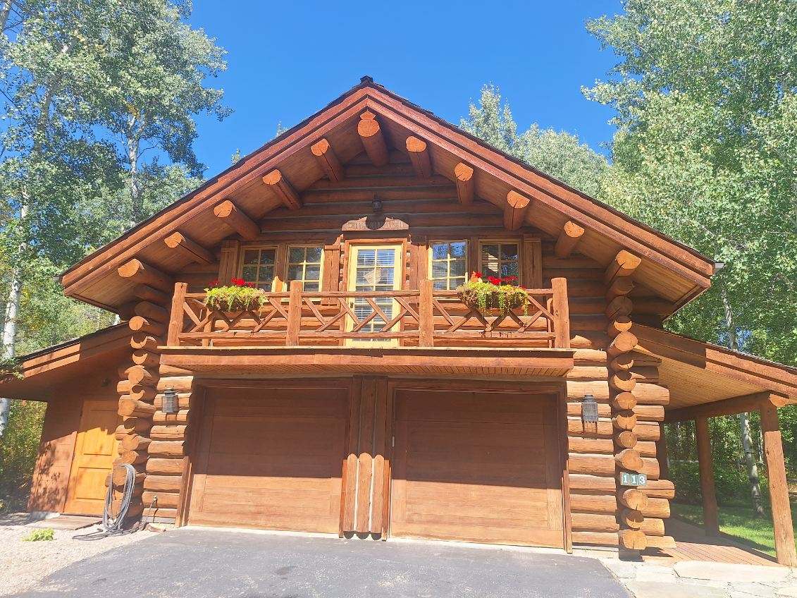 Completed custom log home in Sun Valley, Idaho built by Chase Construction for out-of-state owners